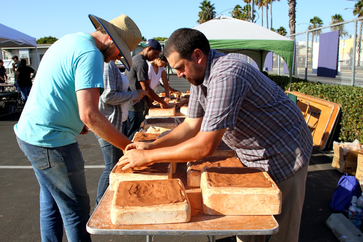 Carlos Ramirez putting clay into molds