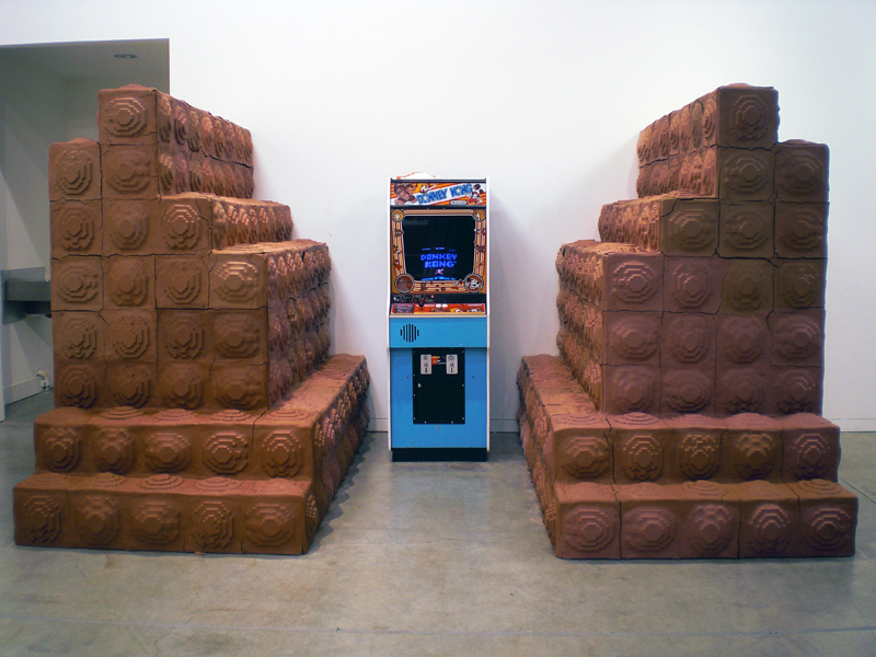 Complete installation view, ceramic tile wall surrounding Donkey Kong arcade game